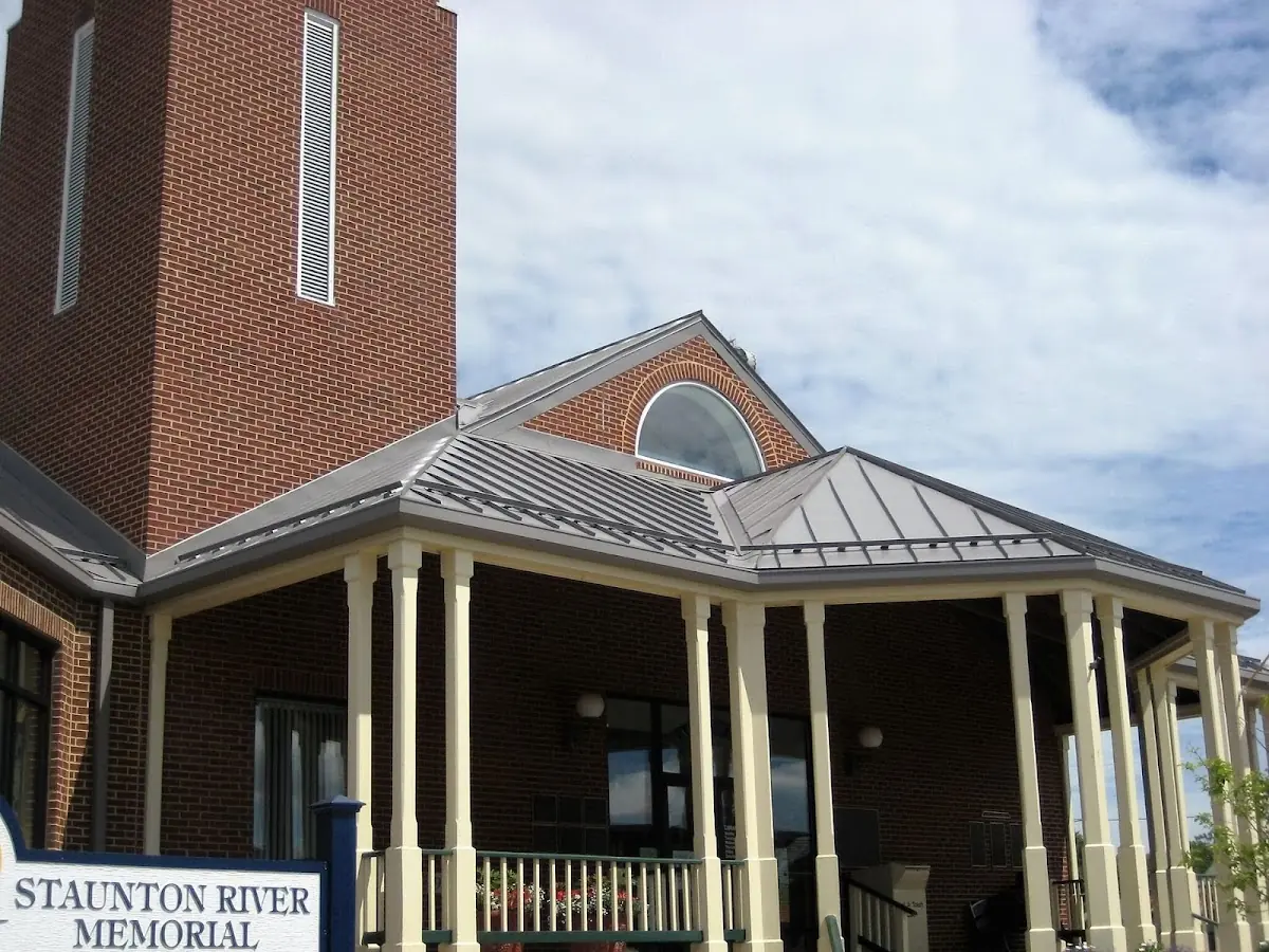 Skilled roofing craftsmen working on a residential roof in Lumberville